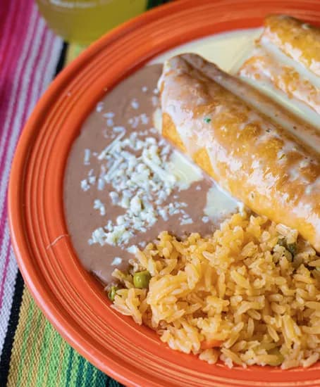 Rice, beans and chimichangas by Mil Amores Taqueria